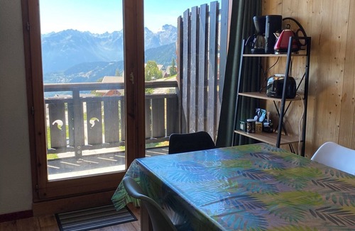 Montgellafrey Apartment | South-facing, large living room, mountain views and private covered parking.
