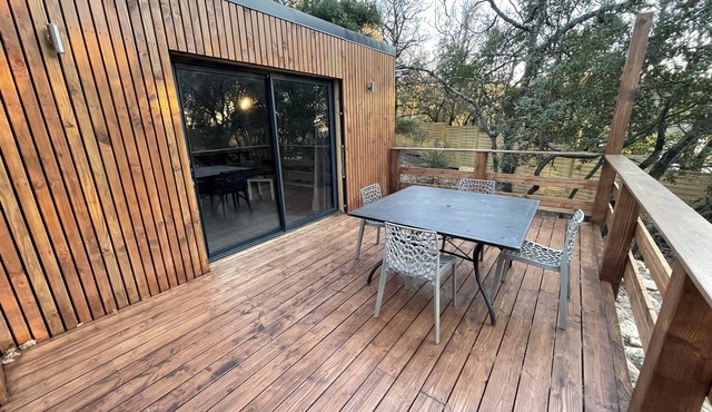 L'échapée belle is a wood-frame cottage in the heart of the forest.