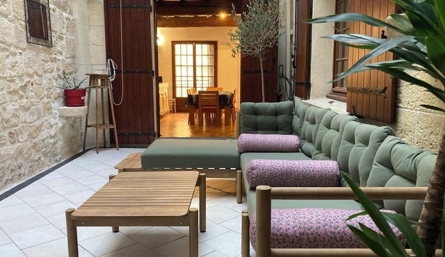 Large house near the canal with a charming patio featuring a glass roof