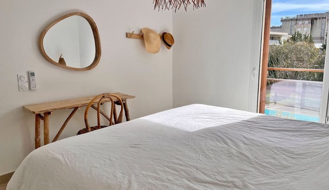 Lovely apartment with two bedrooms, a balcony, a garage, and a pool